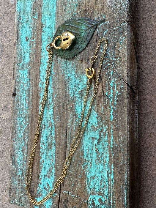 Yellow gold, brass locket, moldavite leaf pendant 18” necklace