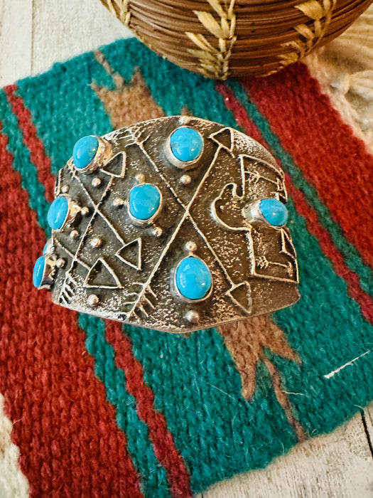 Navajo Turquoise & Sterling Silver Thunderbird Tufa Cast Cuff Bracelet by Delbert Arviso