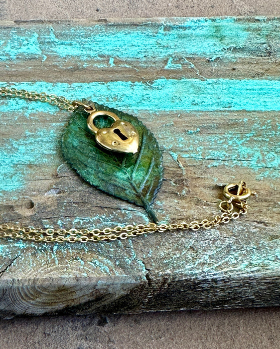 Yellow gold, brass locket, moldavite leaf pendant 18” necklace