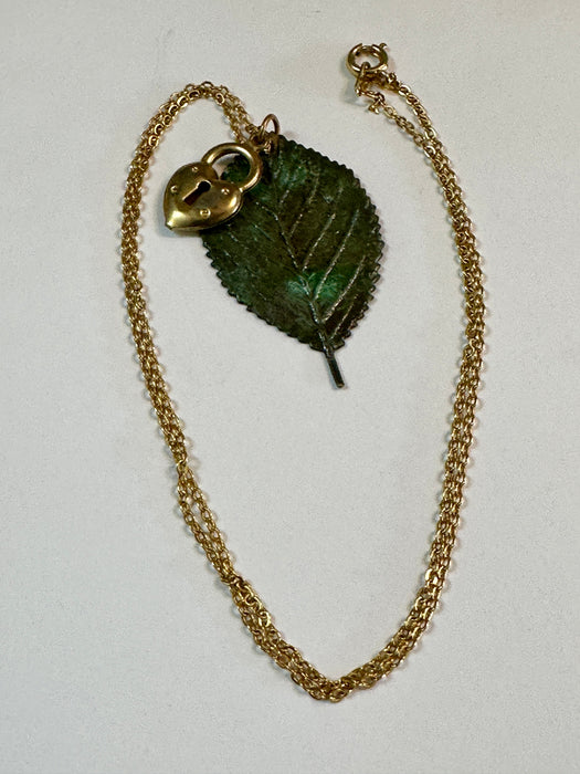 Yellow gold, brass locket, moldavite leaf pendant 18” necklace