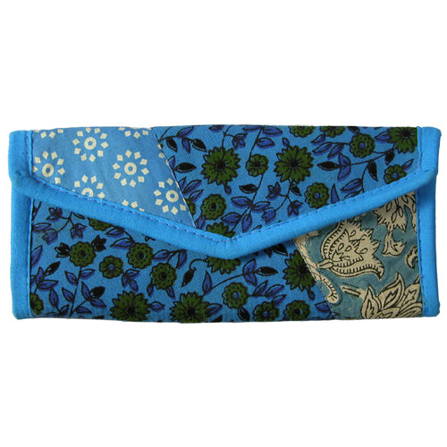 <center>Blue Tone Patchwork Clutch </br>Crafted by Artisans in India </br>Measures 3-1/2” x 8-1/2” when closed</center>